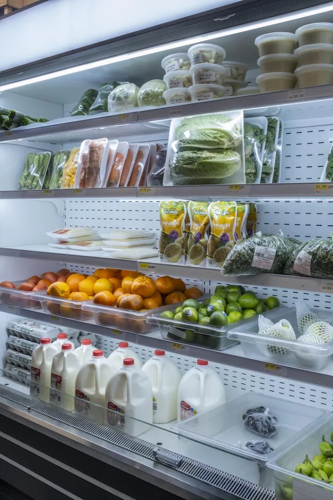 The refrigerated case with fresh produce, dairy and eggs